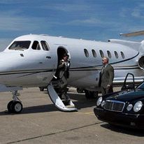 A picture of Nick Hughes of Nick Hughes Coaching picking up a bodyguard client from their private jet to illustrate what I did to arrive where I am