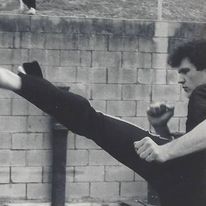 A picture of me throwing a roundhouse kick thirty plus years ago to show my longevity in martial arts.